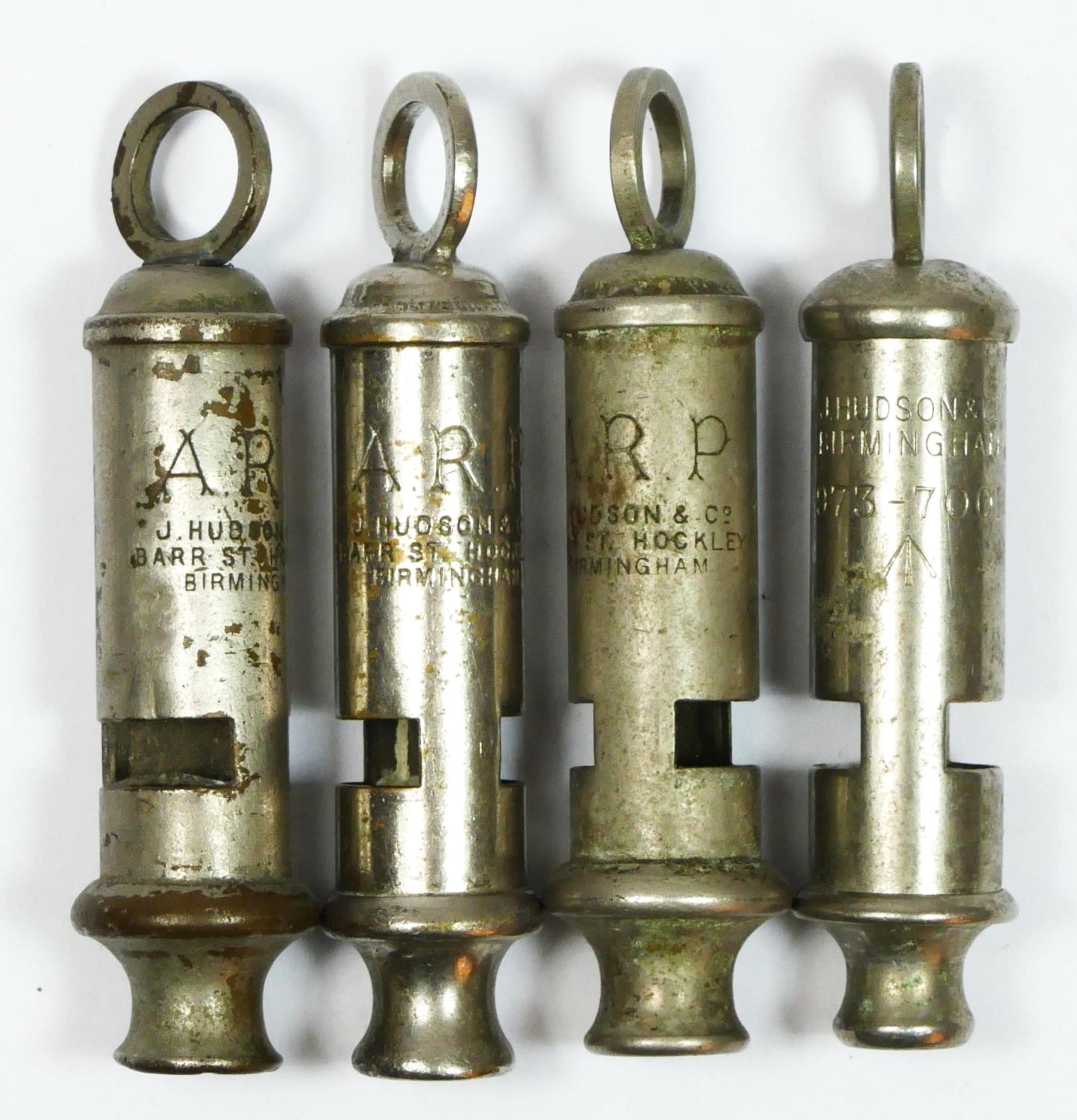 WWII, three ARP Hudson whistles and a military Hudson whistle, broad
