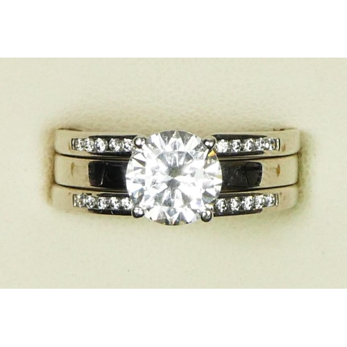 4 - A 14ct white gold and CZ single stone ring, similarly set shoulders, O 1/2, 6.5gm