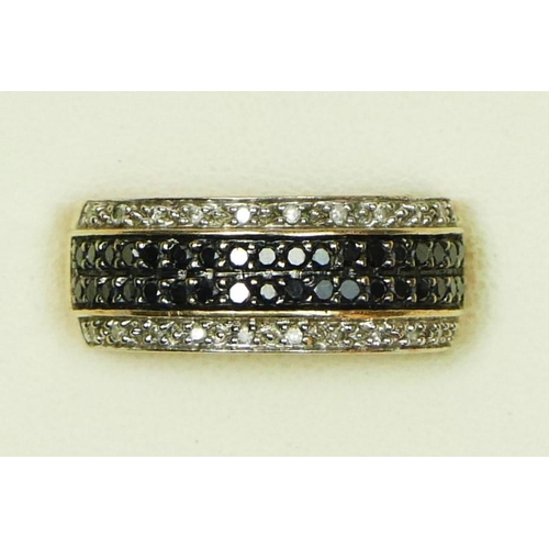 5 - A 9ct gold black and white diamond set dress ring, P, 4.6gm