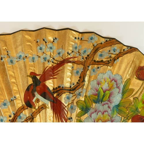 118 - A large decorative fan, 76cm length and 127cm width.