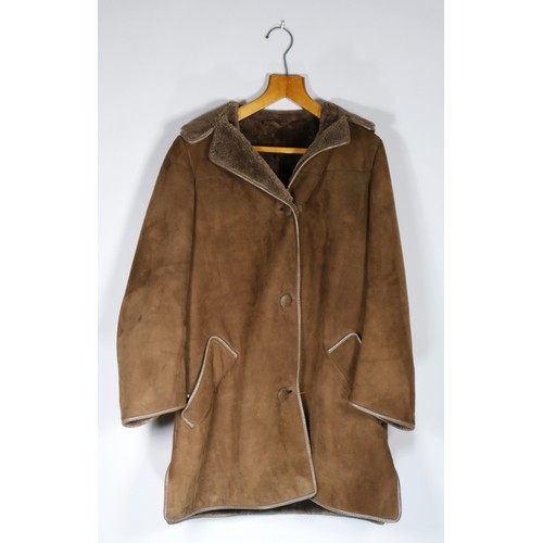 128 - Brown sheepskin coat, size 40.