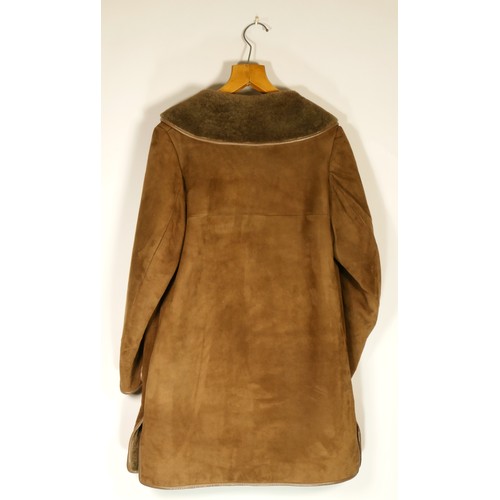 128 - Brown sheepskin coat, size 40.