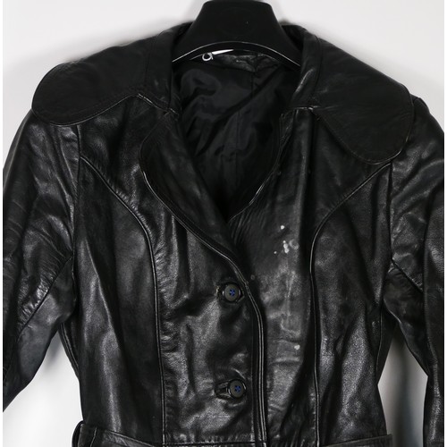 131 - A full length black, button through, single vented belted leather coat purchased around 1977, size 3... 