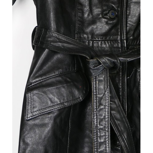 131 - A full length black, button through, single vented belted leather coat purchased around 1977, size 3... 