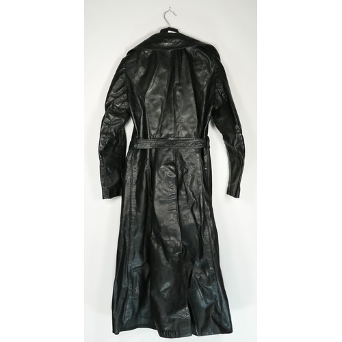 131 - A full length black, button through, single vented belted leather coat purchased around 1977, size 3... 