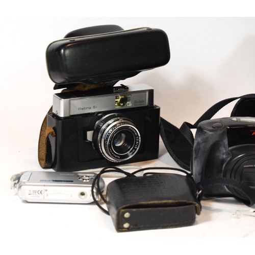 A collection of film and digital cameras to include a Pentax Zoom 105R