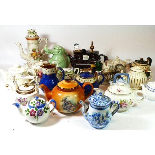 76 - A collection of early 20th century & later ceramic teapots, together with lidded steins and porcelai... 