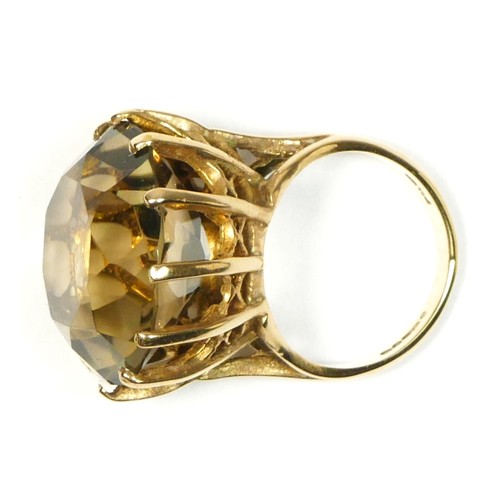 69 - A 9ct gold and citrine dress ring, diameter 20mm, K, 10.4gm