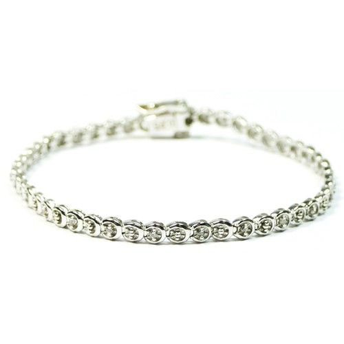 93 - A 9ct white gold and brilliant cut diamond line bracelet, stated weight 0.25cts, 18cm, 7.5gm