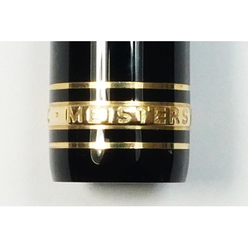 116 - Mont Blanc Meisterstuck, a black body and gold plated rollerball pen, c. 1996, clip ring number EK10... 