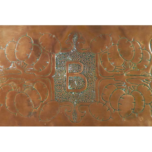 143 - An Arts & Crafts copper two handled tray, embossed B bordered by chased honesty leaves, 60 x 24cm