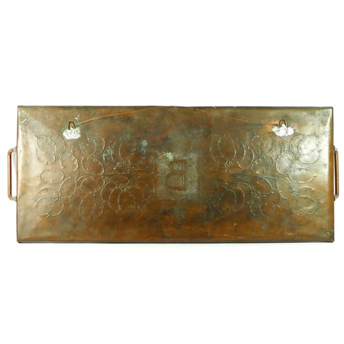 143 - An Arts & Crafts copper two handled tray, embossed B bordered by chased honesty leaves, 60 x 24cm