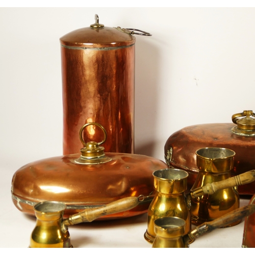 150 - Four various copper bed warmers, a set of four graduated brass pourers and two other copper vessels.