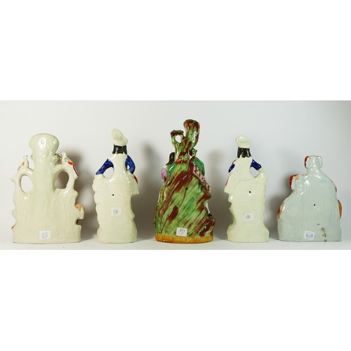 236 - Five Staffordshire pottery flat back figures, to include a spill vase with a cow and horse, 27cm, a ... 