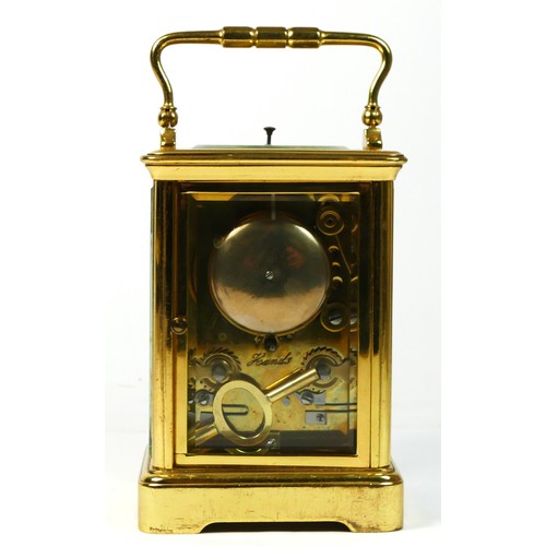 288 - A brass repeating, hour and half hour striking carriage clock, white enamel dial with Roman numerals... 