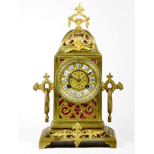 295 - An early 20th century gilt brass Ormolu mantel cock, the elaborate case scroll decoration, cast dial... 