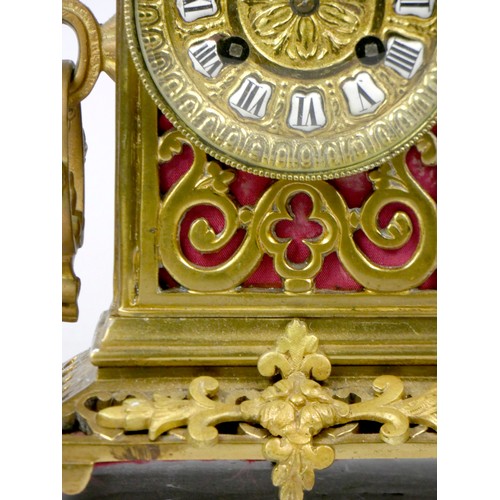 295 - An early 20th century gilt brass Ormolu mantel cock, the elaborate case scroll decoration, cast dial... 