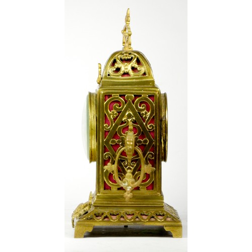 295 - An early 20th century gilt brass Ormolu mantel cock, the elaborate case scroll decoration, cast dial... 