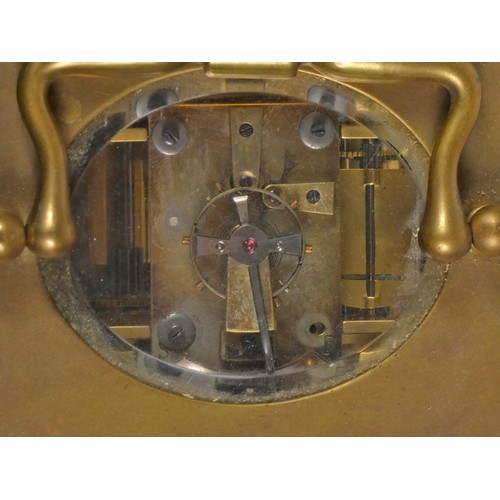 296 - An early 20th century carriage clock, with enamelled dial and Roman numerals, the brass case housing... 