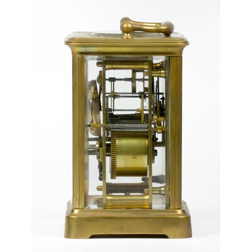 296 - An early 20th century carriage clock, with enamelled dial and Roman numerals, the brass case housing... 