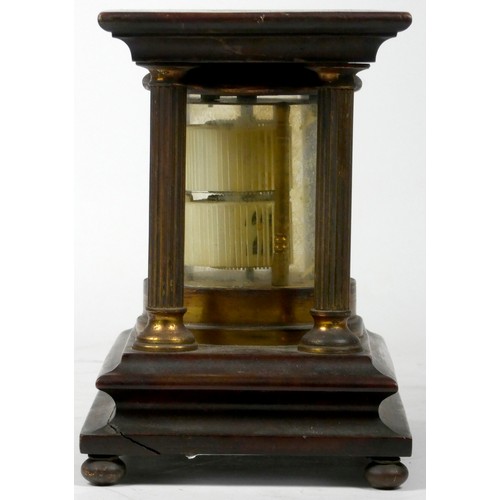 297 - A mahogany and brass 'Ticket' desk clock, of cylindrical form, housed by four reeded brass pillars o... 