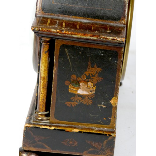 299 - An early 20th century arched mantel clock, gilt brass dial with roman numerals, in a gilded black la... 