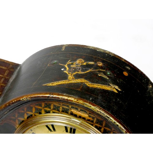 299 - An early 20th century arched mantel clock, gilt brass dial with roman numerals, in a gilded black la... 