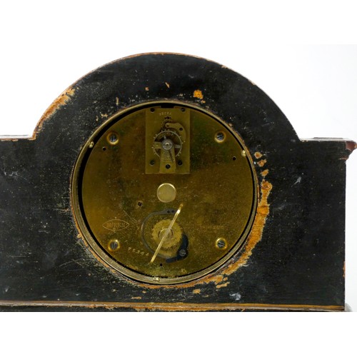 299 - An early 20th century arched mantel clock, gilt brass dial with roman numerals, in a gilded black la... 