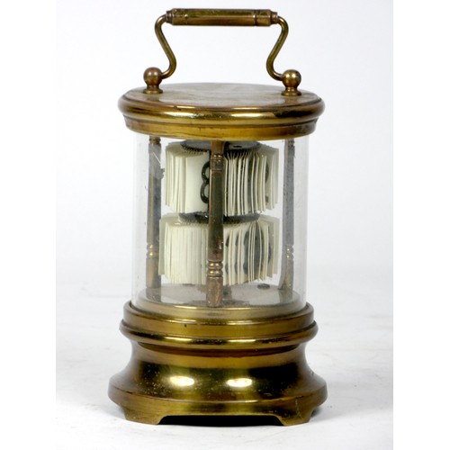 305 - A U.S.A 'Ever-Ready' ticket desk clock, the brass case of cylindrical form with moulded top and bott... 