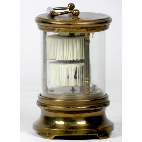 305 - A U.S.A 'Ever-Ready' ticket desk clock, the brass case of cylindrical form with moulded top and bott... 