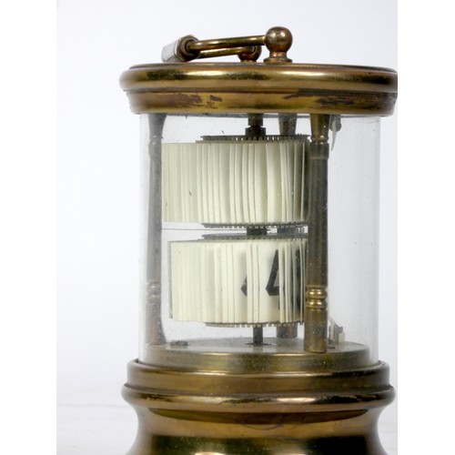 305 - A U.S.A 'Ever-Ready' ticket desk clock, the brass case of cylindrical form with moulded top and bott... 