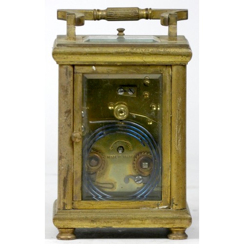 306 - A French carriage clock, of rectangular form having enamelled dial with Roman numerals, the brass ca... 