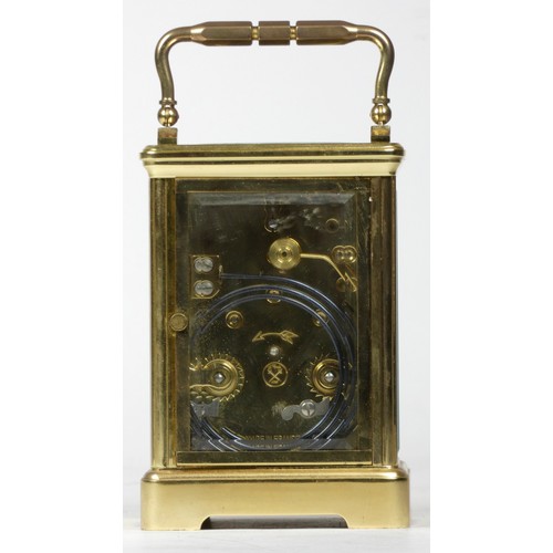 309 - A French brass carriage clock, of rectangular form, the enamelled dial with Roman numerals and inscr... 