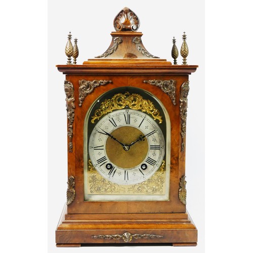 321 - A Victorian mahogany and burr walnut German bracket clock, the bell-top case above four urn finials ... 