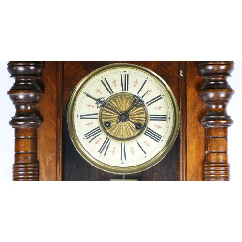 325 - A late 19th century walnut Vienna style wall clock, the movement striking on a gong, pendulum, key, ... 