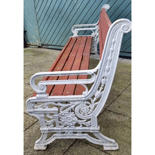 361 - A mid-Victorian cast iron and later weathered hardwood timber slatted three seater garden bench, by ... 