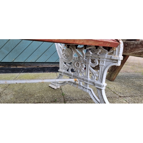 361 - A mid-Victorian cast iron and later weathered hardwood timber slatted three seater garden bench, by ... 