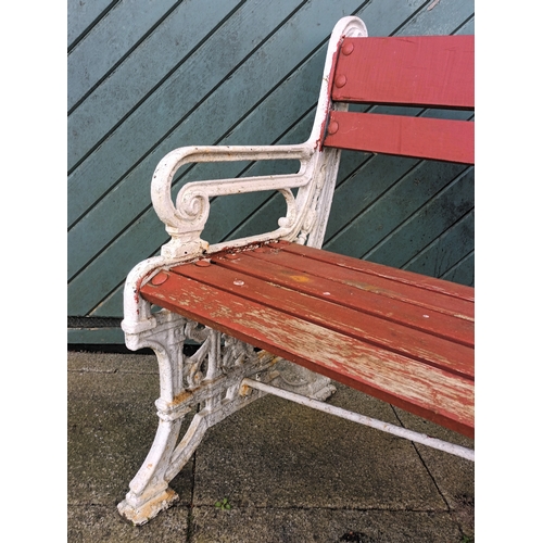 361 - A mid-Victorian cast iron and later weathered hardwood timber slatted three seater garden bench, by ... 