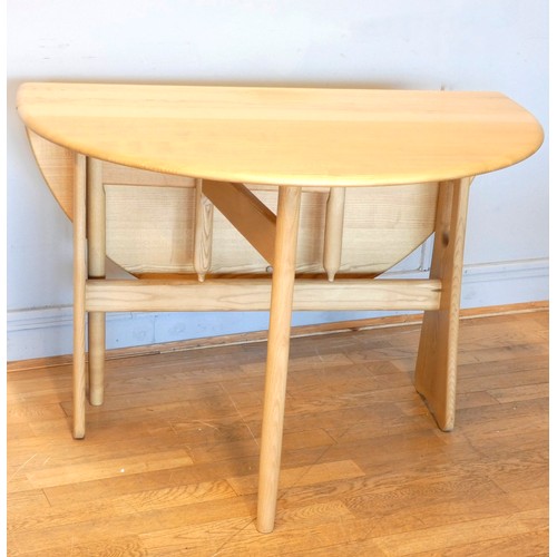 365 - A bleached oak Ercol drop-leaf dining table, having gate-leg action.
122 x 106cm extended.