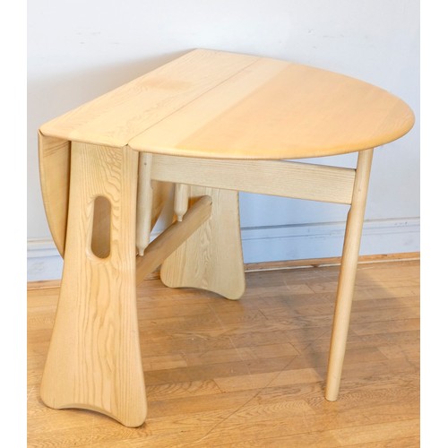 365 - A bleached oak Ercol drop-leaf dining table, having gate-leg action.
122 x 106cm extended.