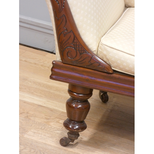 375 - A Victorian mahogany framed chaise lounge,  with carved floral decoration back and front rail, reuph... 