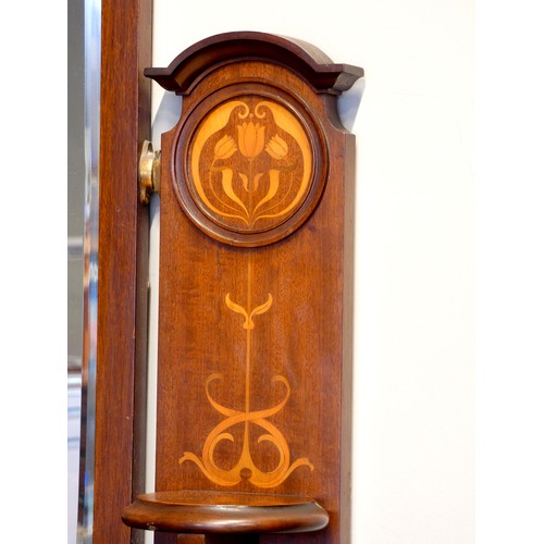 377 - An Edwardian mahogany dressing table, inlaid gallery with central swivel mirror over two short and t... 