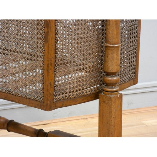 381 - A Victorian mahogany and cane work cradle, of traditional form, raised on turned supports.
L94, H118... 