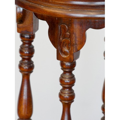 382 - A mahogany jardiniere stand with circular top and turned supports on cabriole legs.
100cm tall.