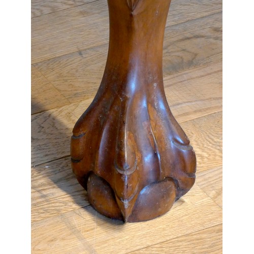 388 - An Indonesian carved hardwood lowboy, the plain top with applied moulded edge over two long and two ... 