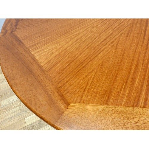 364 - A circular mahogany dining table, c.1960/70's, with sunburst pattern and eight stylised sectional bo... 