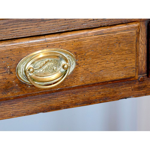 400 - A Georgian oak lowboy, having thumbnail edged top over two frieze drawers with brass loop handles, o... 