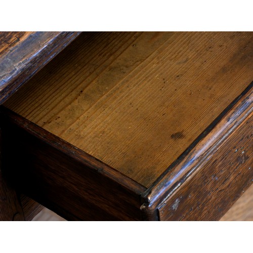 400 - A Georgian oak lowboy, having thumbnail edged top over two frieze drawers with brass loop handles, o... 