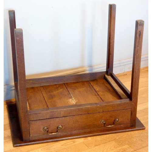 401 - A Georgian oak lowboy, having rounded edged top over a narrow central frieze drawer within a squared... 