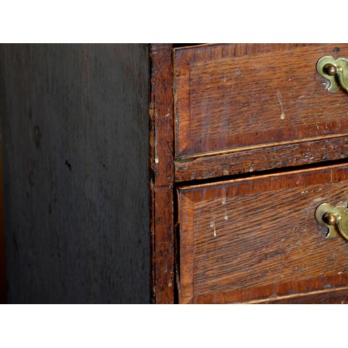 395 - A 19th century oak and parquetry inlay chest of drawers, having thumbnail edged top, over two short ... 